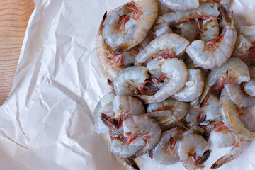 Several pounds of freshly caught Mayport shrimp. Shown in butcher paper, close view. 