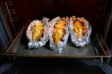 Baked fish with spices in the oven. Cooked food.