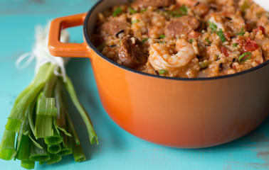Pot of jambalaya with andouille sausage and shrimp, close up view.