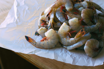 Several pounds of freshly caught Mayport shrimp. Shown in butcher paper, close view. 