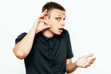 Overhears a man, tries to listen.