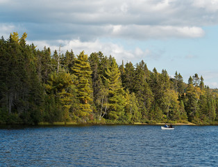 Two people canoeing on a lake in Mont-Tremblant National Park, Quebec