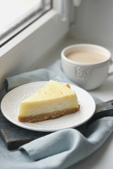 Serving of cheesecake on a white saucer