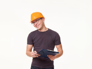 young man - worker in a helmet with a folder