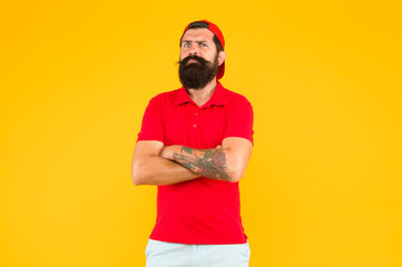 Naklejka premium Schedule your tattoo session. Hipster with ink tattoo yellow background. Bearded man wear tattoo covering skin. Tattoo and tattooing. Ink studio