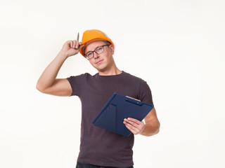 young man - worker in a helmet with a folder