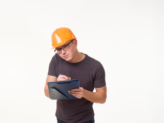 young man - worker in a helmet with a folder