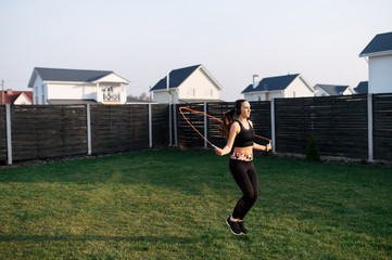 Woman doing cardio workout in the backyard