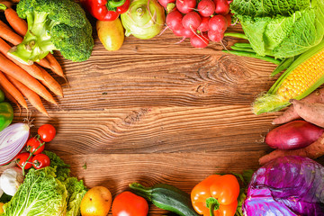 Vegetables on wood. Healthy various vegetable food, herbs and spices. Space for text.