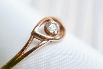 Gold wedding ring with ribbon macro.