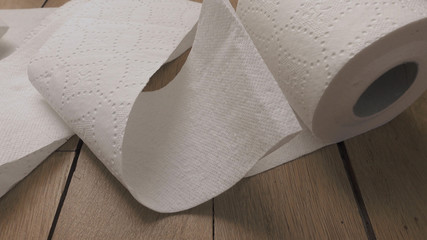 Unrolling toilet paper.