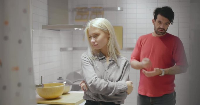 Family quarrels. Home tyrant husband scolding making claims to his upset wife