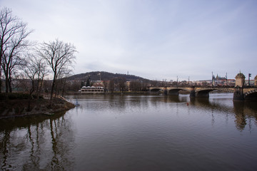 Fototapeta premium River and a bridge over Vltava river in Prague