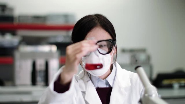 Scientist wearing lab coat working in laboratory