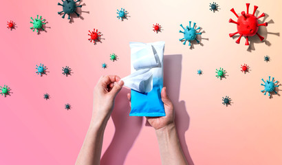 Sanitizer wipe with coronavirus concept - flat lay