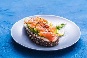 Sandwich with smoked salmon and cucumber. Concept for healthy nutrition.