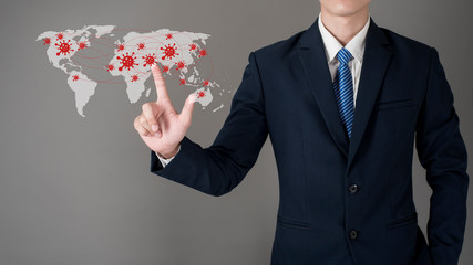 Close up of business man is touching World map of covid-19