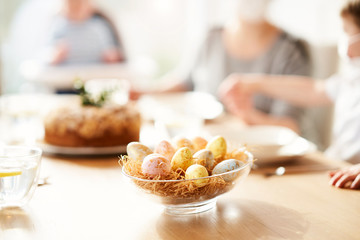 Family at home quarantine over Easter table