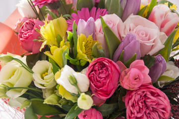 Delicate bouquet of garden flowers on a white background