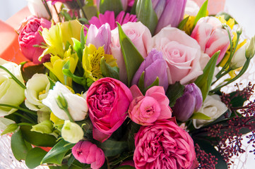 Beautiful roses, tulips, lilacs and others in a bright bouquet.