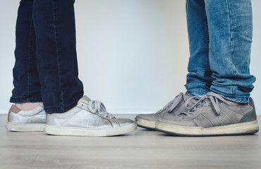 Two people standing close together