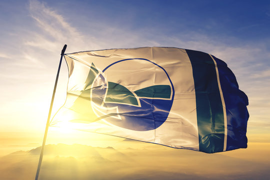 Matapedia of Quebec of Canada flag waving on the top sunrise mist fog