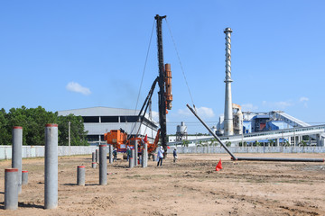 Fototapeta na wymiar diesel hammer pile driving machine working on construction field