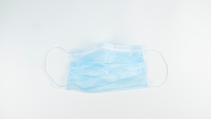 Medical protective mask isolated on white background. Top view