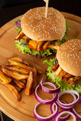 Burgers on a wooden tray