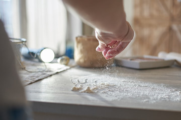 a woman's hand pours wheat flour. baker's hand closeup. Cooking pizza, bread