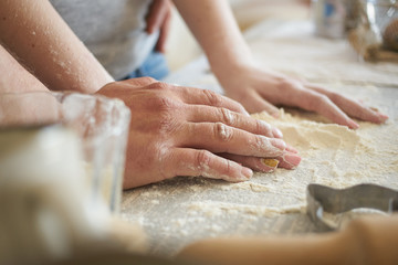 women's and men's hands mix wheat flour. baker's hand closeup.couple together Cooking pizza, bread