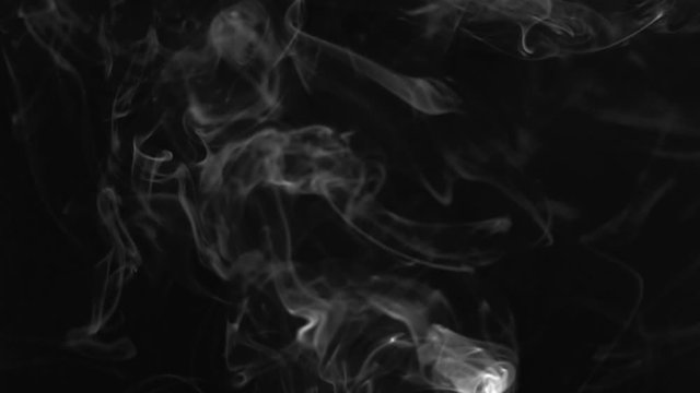 White  smoke or vape on black background slow motion