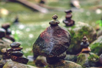 Rocks in balance on the shore of spring or river