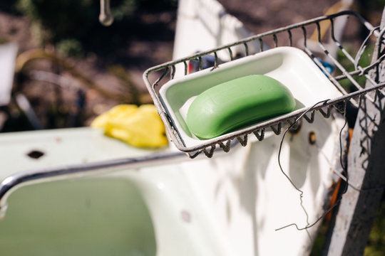 Bar Of Soap In An Old Soap Box. Dry Leaves Fell Into The Soap Box.