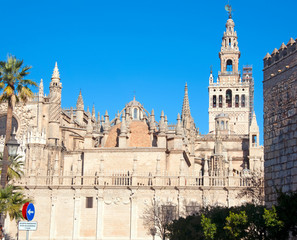 Fototapeta na wymiar Side view to the cathedral of Seville, Spain.Clear blue sky, sunny winter day