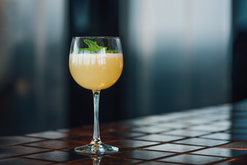 Melon Fizz cocktail on the bar counter. Close-up.