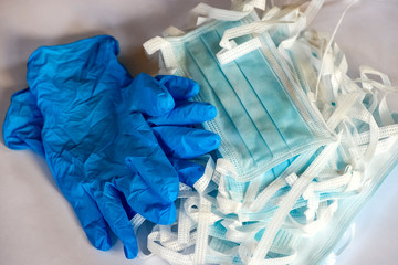 Blue medical protective masks and blue protective gloves.