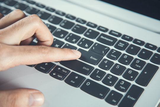 man hand computer with enter