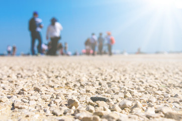 Fototapeta na wymiar beach with people as a background, blurred