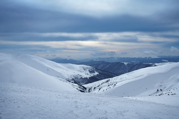 Fototapeta na wymiar Snow-capped peaks of the Ukrainian Carpathians