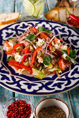 Fresh salad with beef, herbs and red pepper.