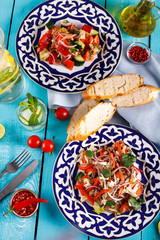 Fresh salad with beef, herbs and red pepper.