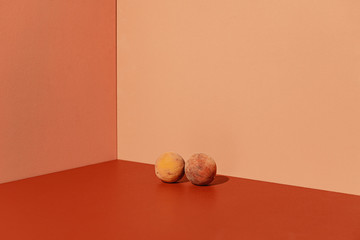 Peaches on Coral Colored Background