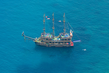 Alanya. Turkey. Mediterranean Sea. Traditional entertainment resort of Alanya. Sailing aka pirate ships around the fortress of Alanya. View from the bird's-eye view.