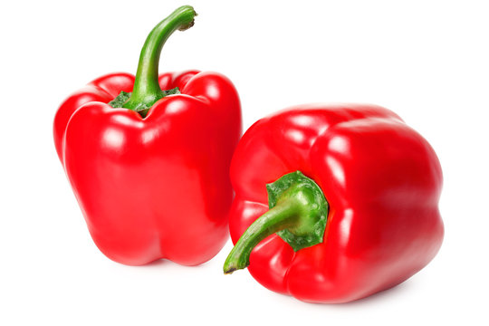 two red sweet bell peppers isolated on white background