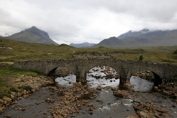 Sligachan - Skye Island (Scotland), UK - August 14, 2018: Sligachan Old Bridge looking towards the Cuillin mountain range, Isle of Skye, Inner Hebrides, Scotland, United Kingdom