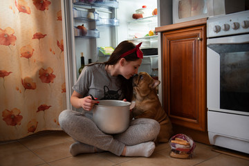 girl with french bulldog try tasty quarantine dinner at home