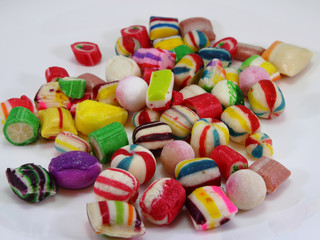 candies in different colors on a white background