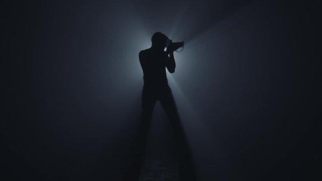 Photographer in dark