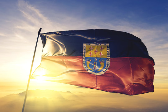 Cucuta of Colombia flag waving on the top sunrise mist fog